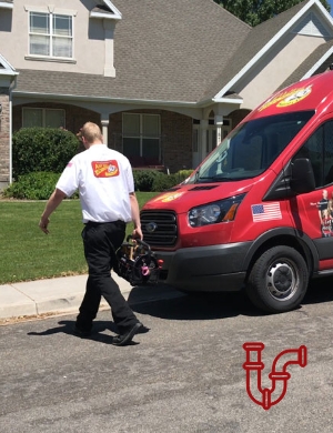 Plumber walking from service van to customers front door